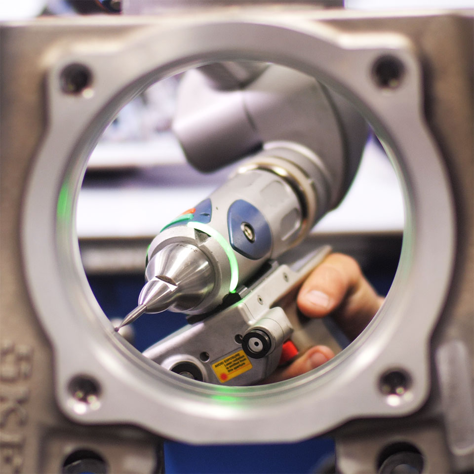 Eagle CNC quality and inspection: Faro laser arm inspecting cast and machined component